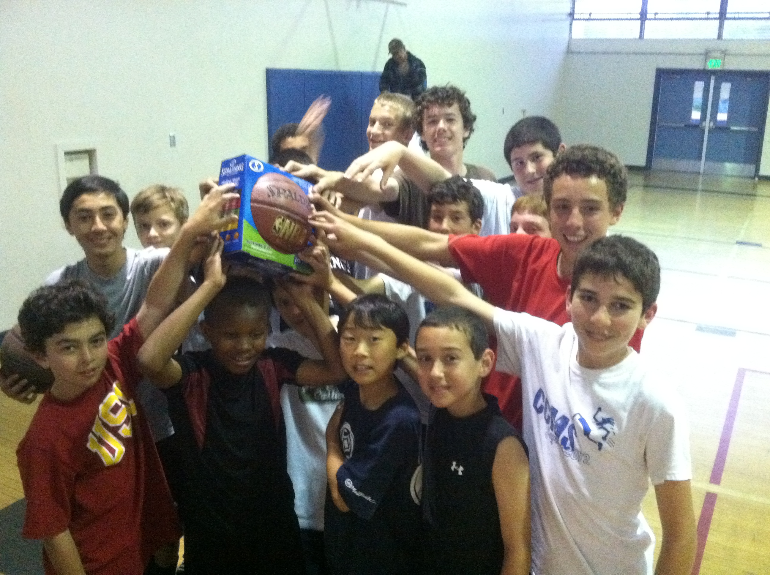 Warriors team celebrating with championship ball